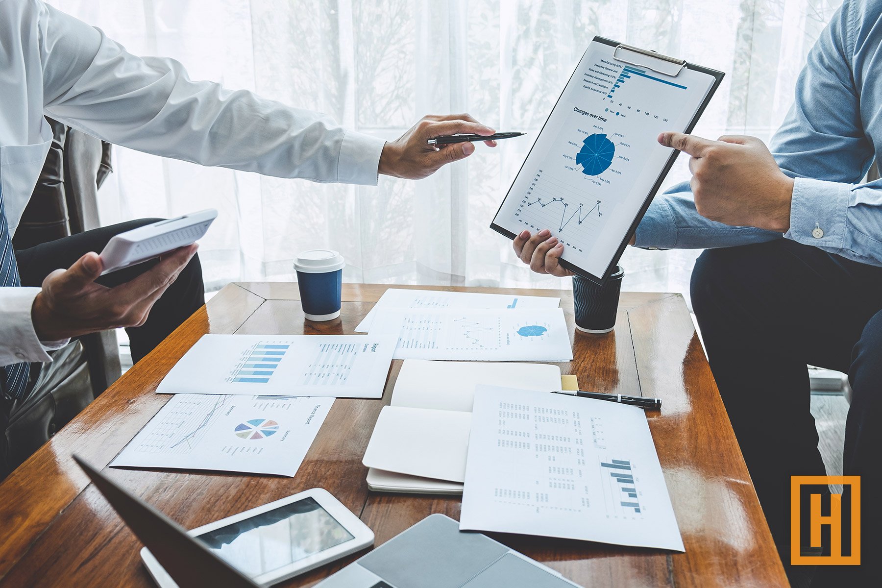 investors review data on a clipboard